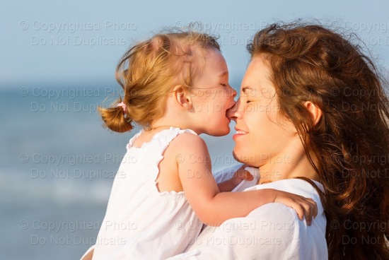 Mom & Child At The Beach