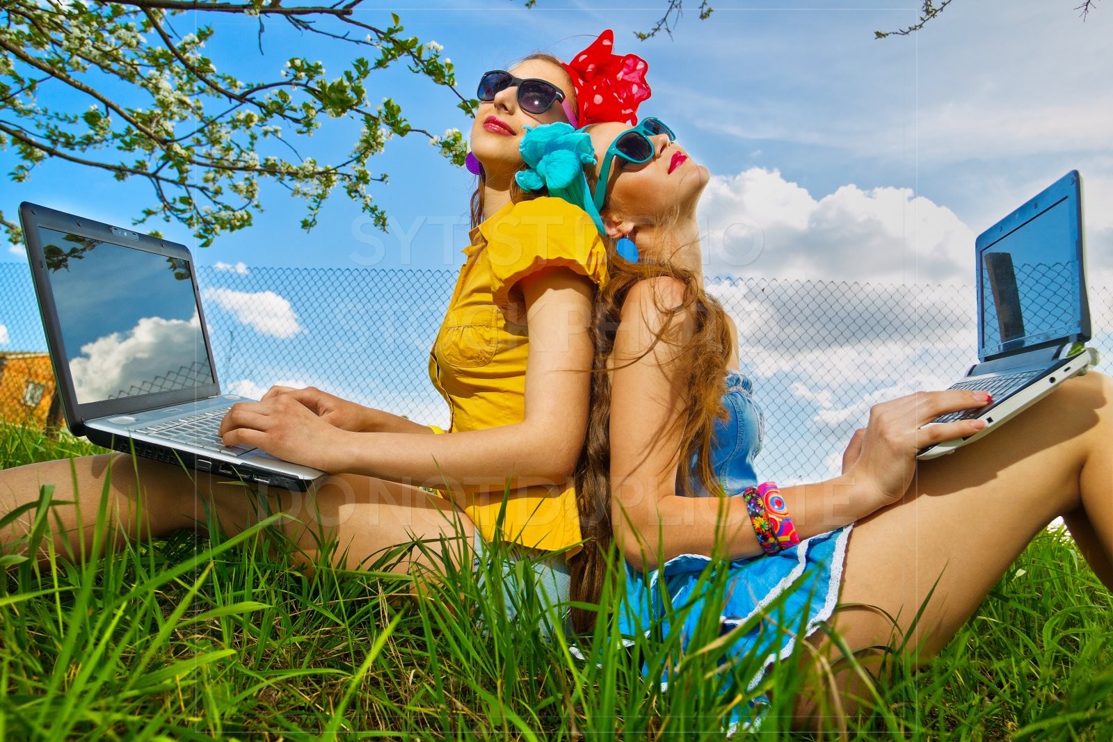 Ladies outside on computers